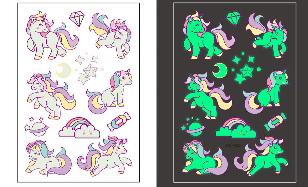 Temporary tattoo sheet with pastel cartoon unicorns, stars, rainbows, and moons that glow in the dark, 110×75mm.