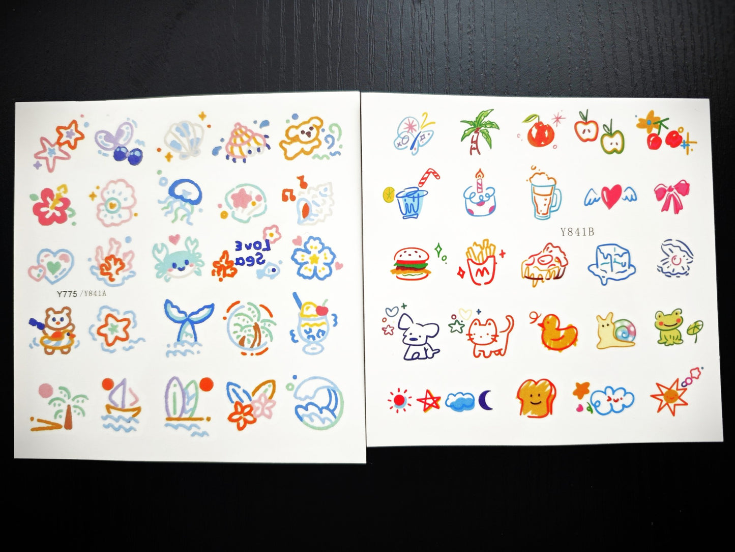 Summer-themed temporary tattoo sticker collection – 25×20mm colourful illustrations including animals, beach elements, food, and celestial icons by TIDES.