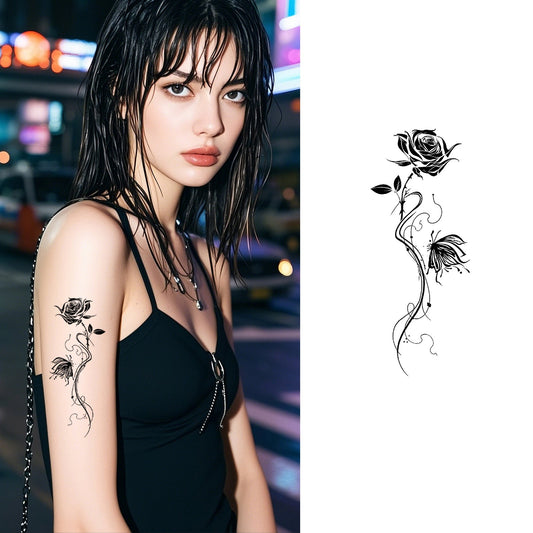 Black and white temporary tattoo of a rose connected to a flower by a winding vine with leaves – floral outline design by TIDES